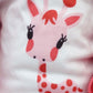 White shirt with red and orange animal face print and small heart accents on the doll