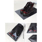 Black drawstring shoe storage bag set with clear panels, holding red lace-up boots