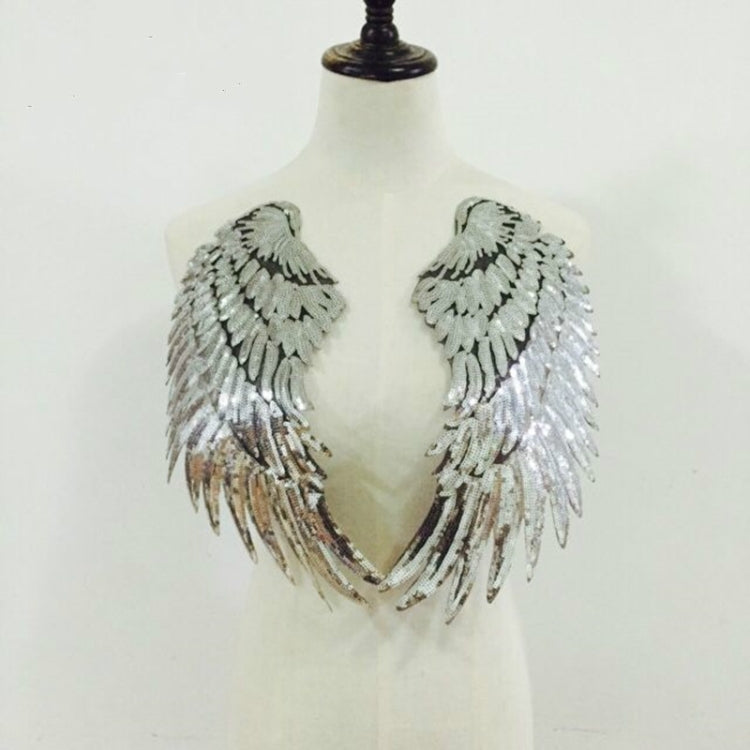 Silver sequin feather wing patches shown on a mannequin torso