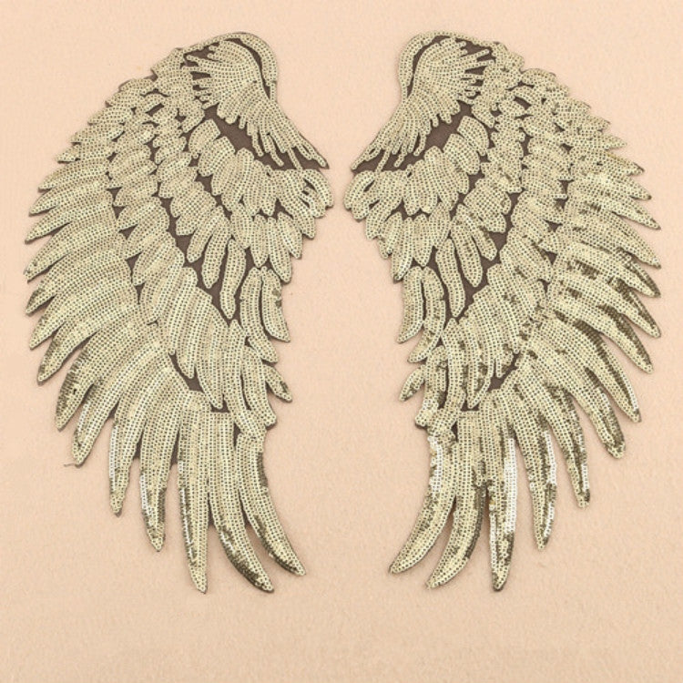 Pair of silver sequin feather wing patches with intricate feather-like pattern