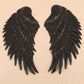 Two dark sequin feather wing appliques with jagged fringe tips for clothing DIY.
