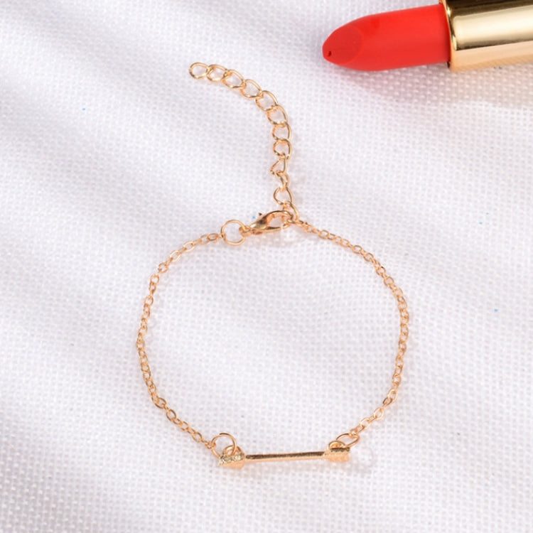 Gold-tone chain bracelet with small links and bar charm with crystal accent