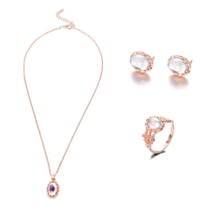 Rose-gold tone opal crystal pendant necklace with matching stud earrings and ring