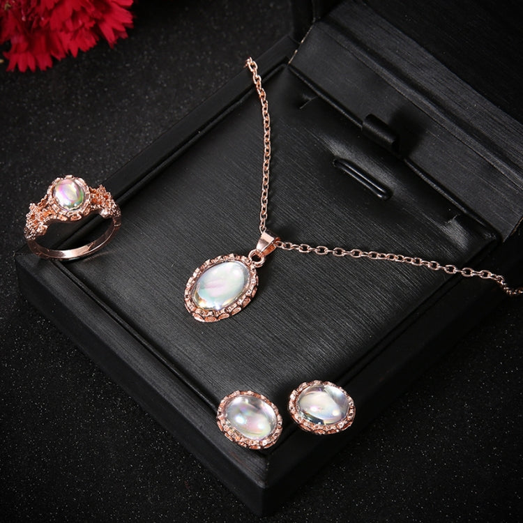 Rose-gold tone opal crystal jewelry set: pendant necklace, stud earrings, and ring