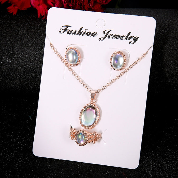 Rose-gold tone opal crystal pendant necklace with stud earrings on jewelry card