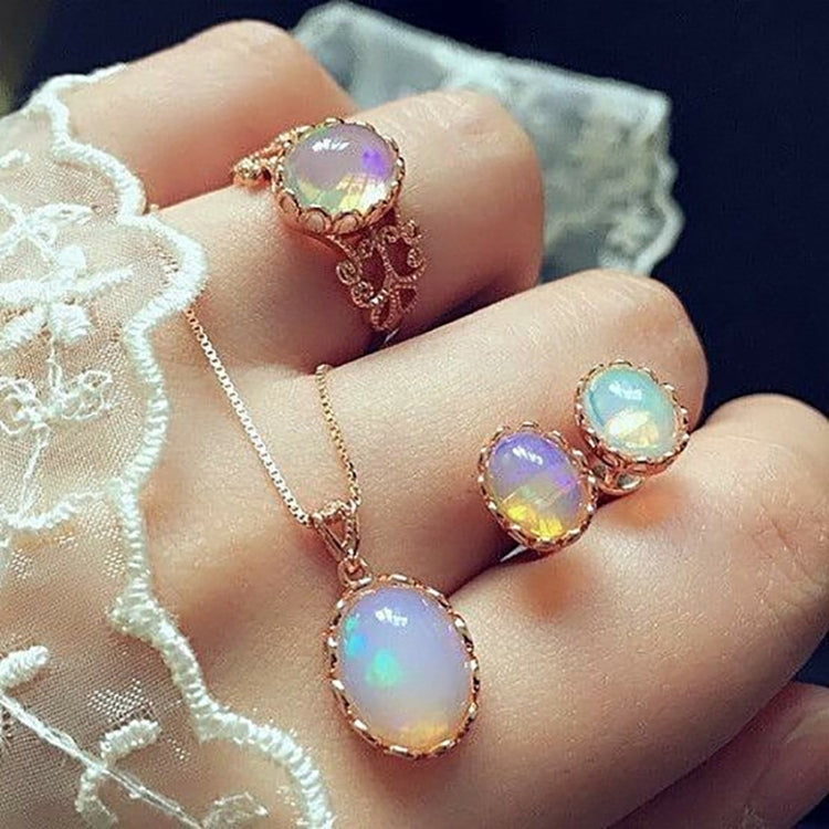 Rose-gold tone opal crystal pendant necklace with matching opal-style rings and earrings
