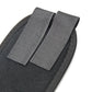 Gray cushioned toe separator pads with fabric straps, close-up view
