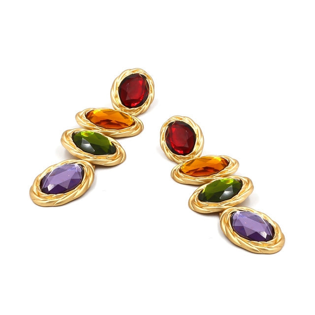 Gold-tone drop earrings with red, orange, green, and purple stacked oval gems