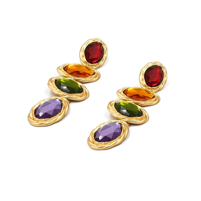 Gold-tone drop earrings with red, amber, green, and purple oval gemstone dangles