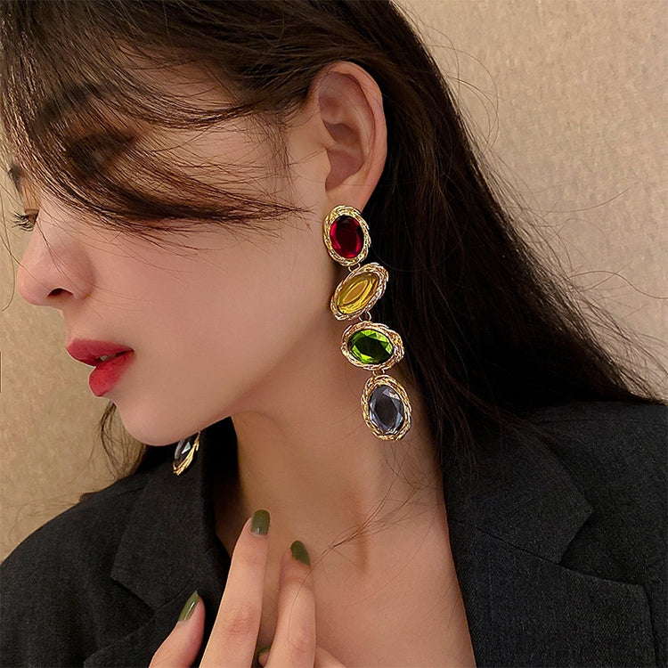 Gold-tone oval gemstone drop earrings in red, yellow, green, and purple