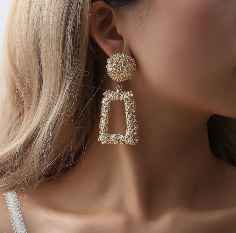 Gold-tone geometric trapezoid long dangle earrings with textured round tops