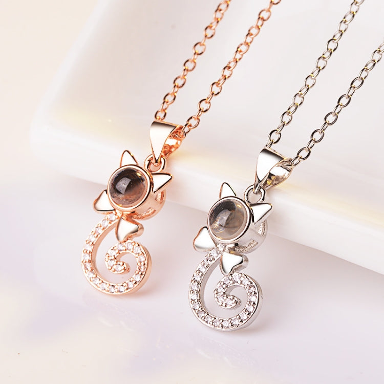 Rose gold and silver projection pendant necklaces with round discs and heart swirl charms