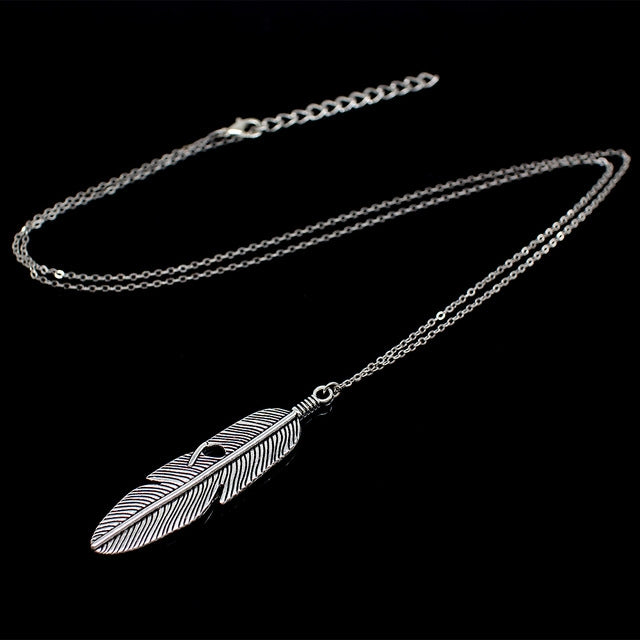 Silver feather pendant long chain necklace with leaf-textured feather charm