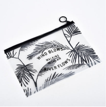 Transparent PVC cosmetic bag with black zipper and tropical palm print, wrist loop handle