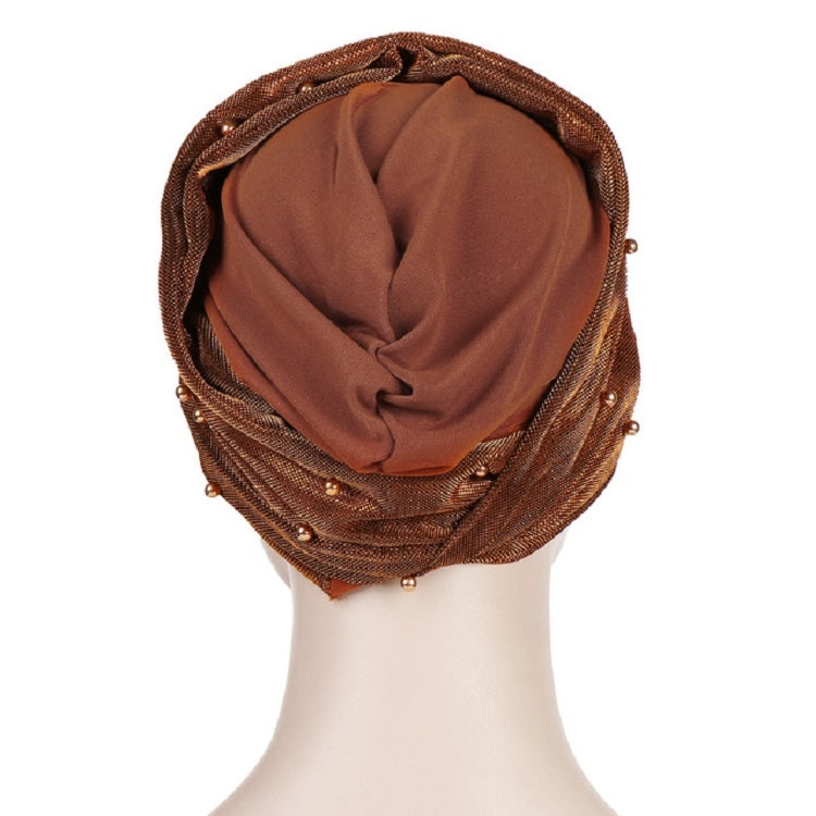 Brown beaded turban hat with draped inner lining and pearl-studded outer edge