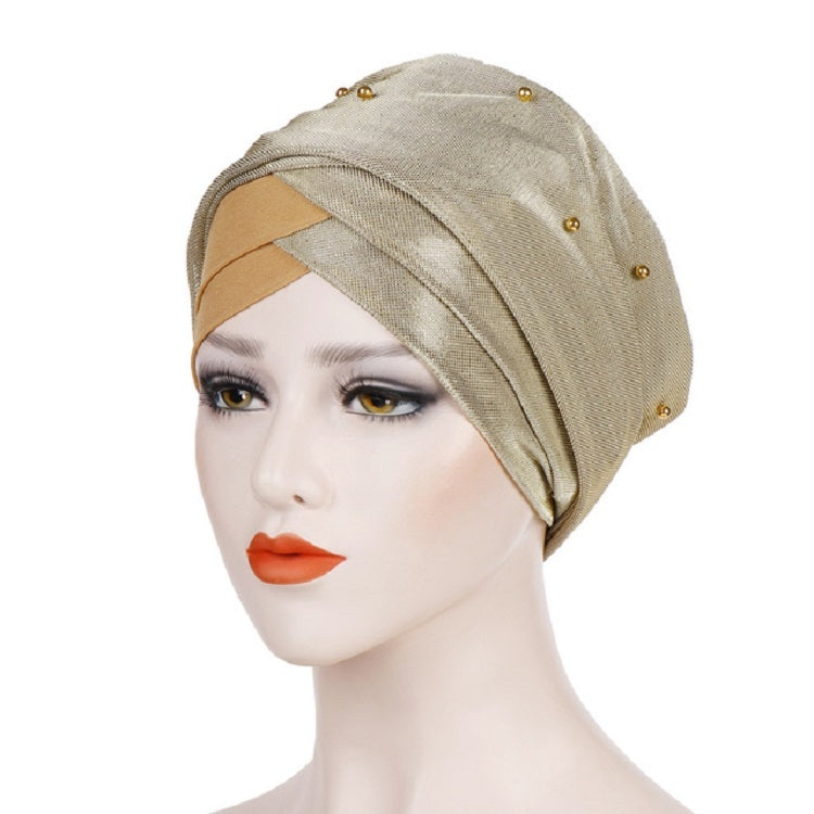 Beige and gold-tone beaded turban hat with draped fabric band and pearl studs