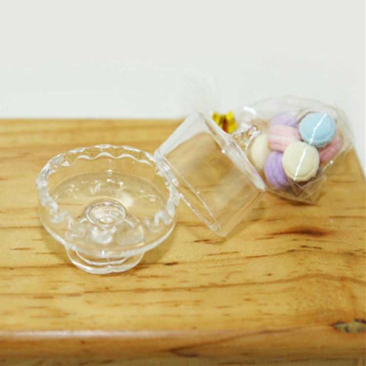 Mini clear candy jar with pastel candies in open container