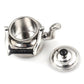 Miniature metal tea kettle with open round top, silver spout and small side handles.