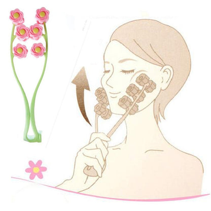 Pink flower roller face massager with green handle and multiple rotating heads