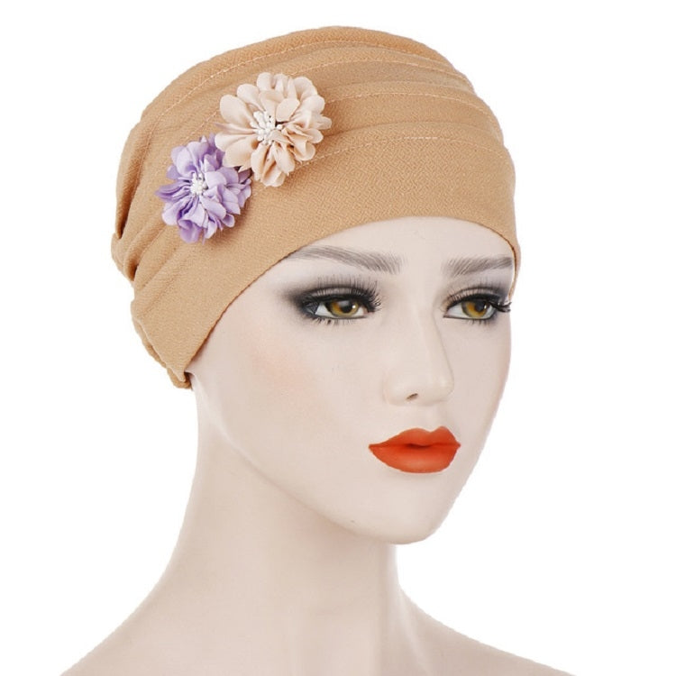 Khaki linen turban hat wrap with floral accents on the front crown
