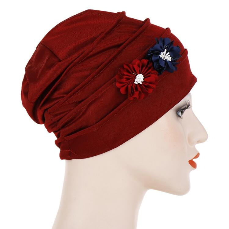 Burgundy linen turban hat wrap with blue and red flower appliques, side view