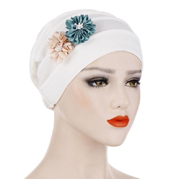 White linen turban hat wrap with teal and cream flower appliques