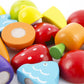 Close-up of colorful fruit and vegetable wooden cutting pieces