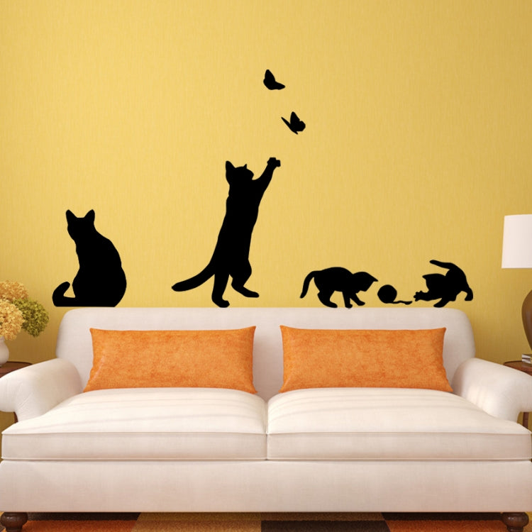 Black cat wall sticker group with butterflies above a couch for room decor