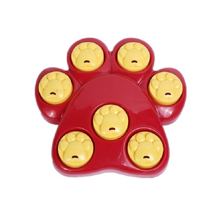 Red paw-shaped puzzle feeder bowl with five yellow smile inserts