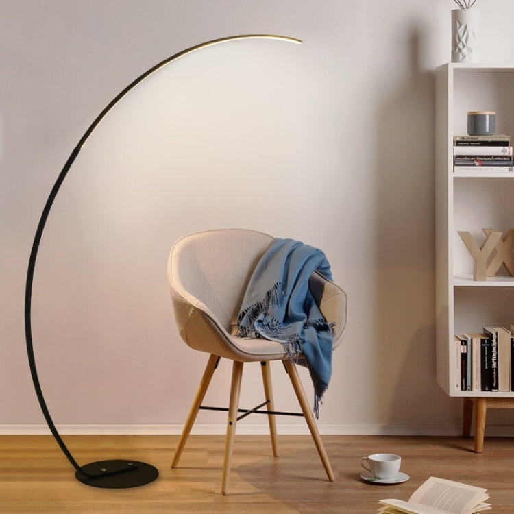 Arc floor lamp with glowing light bar and round base