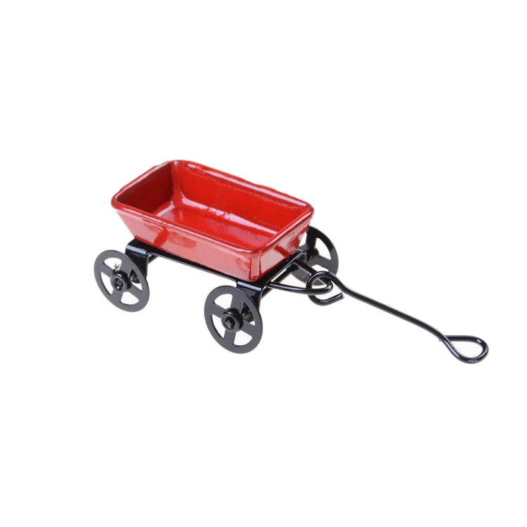 Mini red metal pulling cart with black wheels and long pull handle