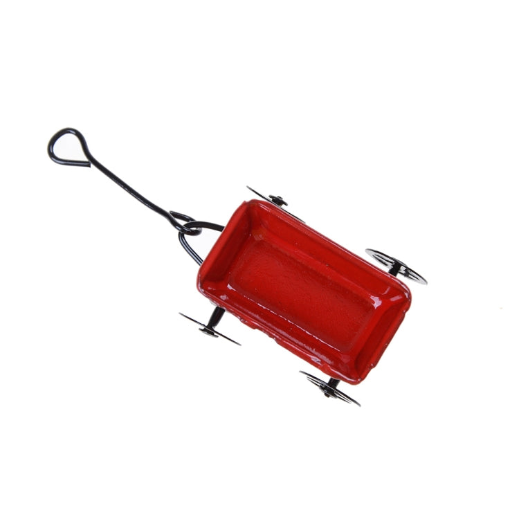 Mini red metal cart with black frame, tray, and loop pull handle