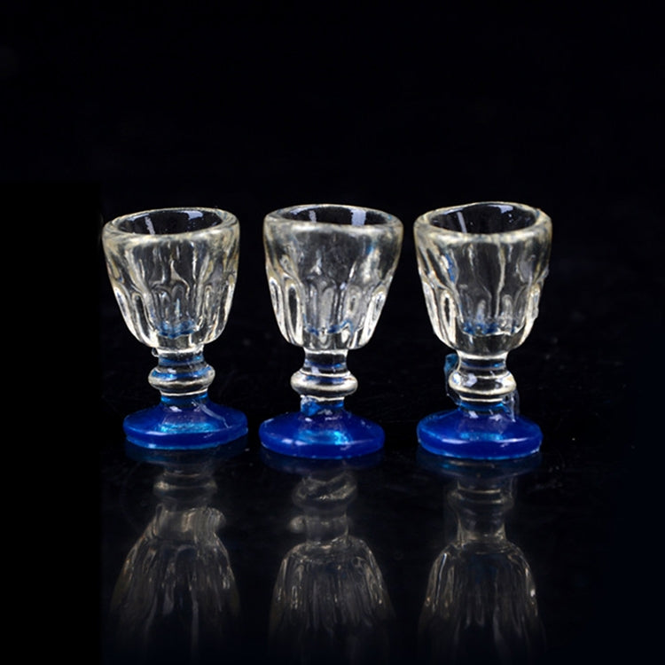 Three mini transparent goblet glasses with blue bases for dollhouse accessories