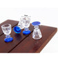 Mini transparent goblet glasses with blue bases, size markings