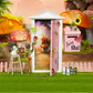 Miniature fairy tale door, pink with gold trim and hanging charm details, white frame