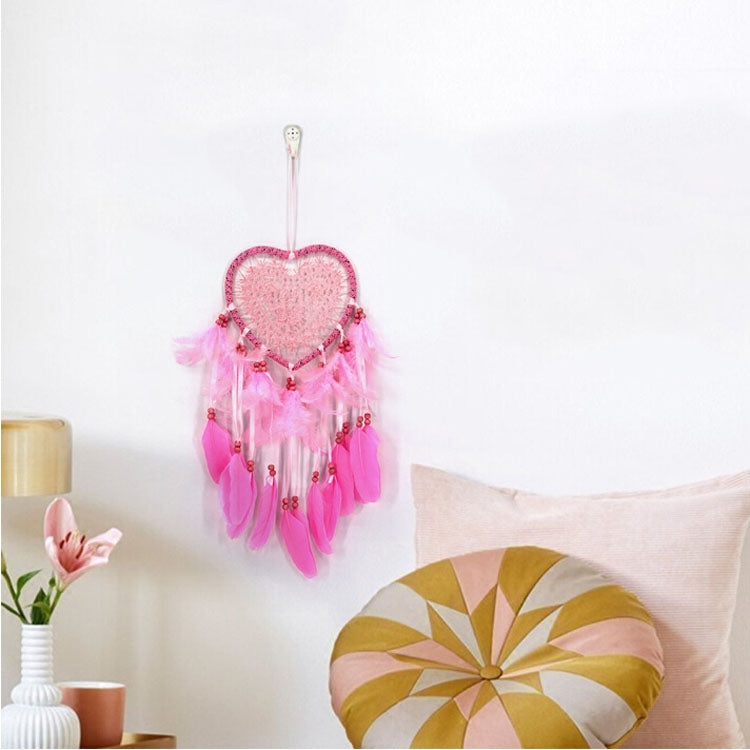 Pink heart dream catcher wall hanging with feather fringe and bead accents