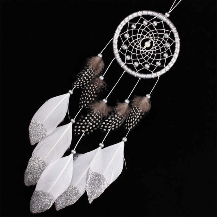 Silver-and-white dreamcatcher wall hanging with dotted feather charms and round bead accents