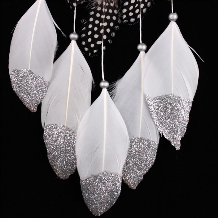 Dreamcatcher feathers in white with glittery silver tips, linked by bead strings