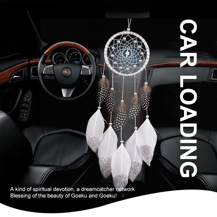 Center-hanging dreamcatcher with silver web and white glitter-tipped feather tassels