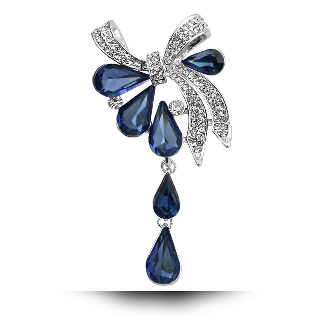 Blue teardrop butterfly knot brooch with rhinestone accents and dangling drop charms