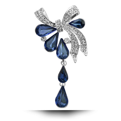 Blue teardrop butterfly knot brooch with rhinestone accents and dangling drop charms