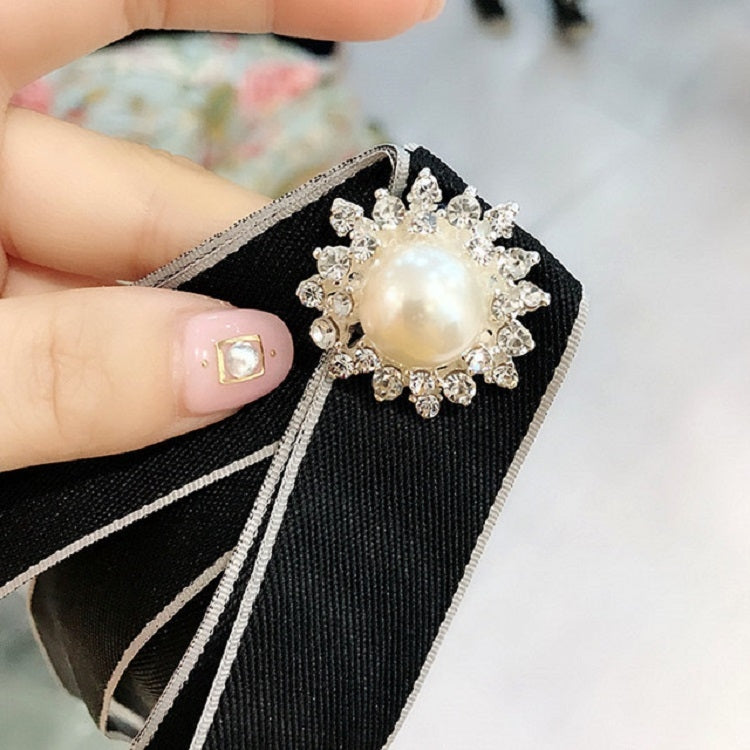Black ribbon bow-knot brooch with large faux pearl and rhinestone halo centerpiece