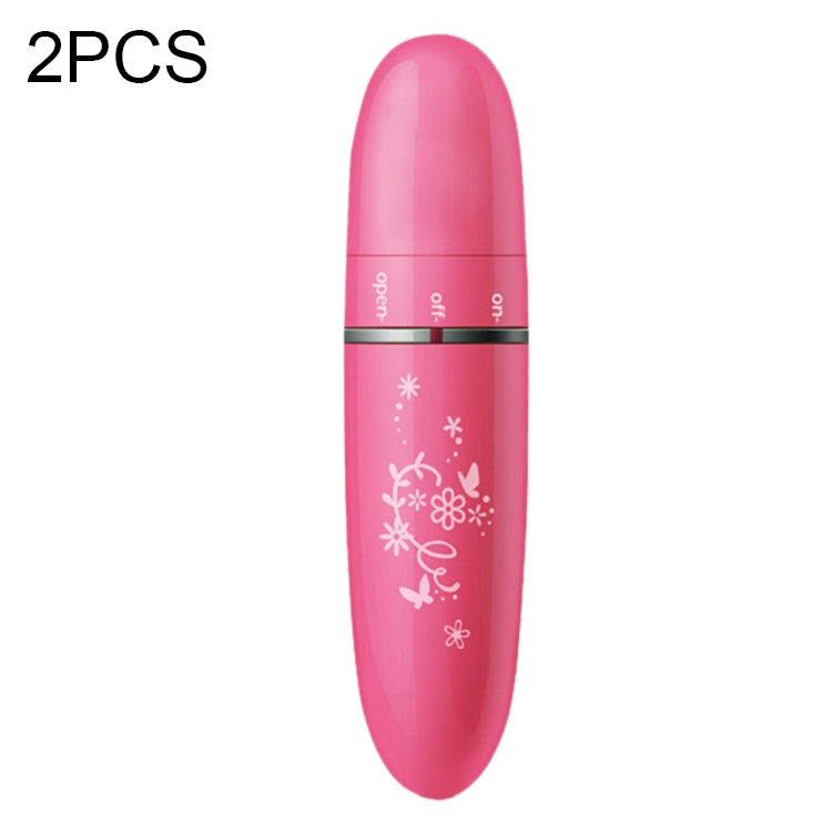 Pink mini electric eye massager, oval handheld with control buttons and floral print