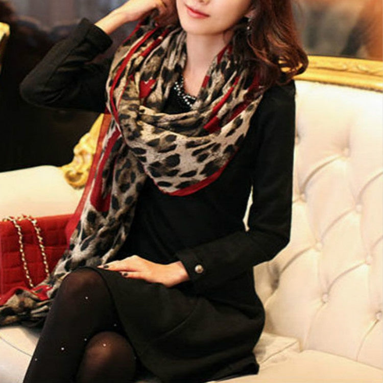 Leopard-print heart-pattern scarf shawl with red trim, wrapped on model