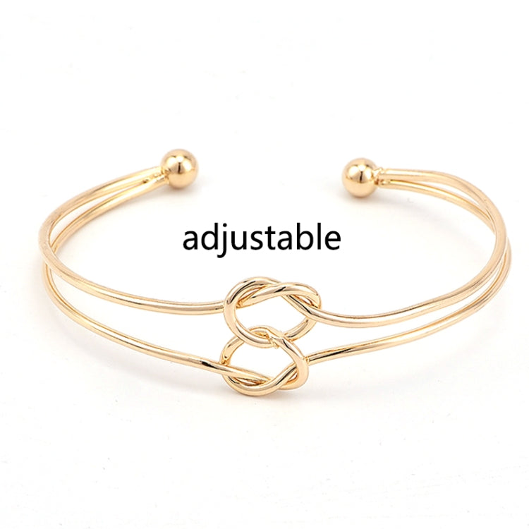 Gold-tone adjustable metal chain bracelet with double knot loop and ball ends