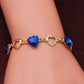 Blue crystal heart charm bracelet with rhinestone heart center on wrist