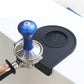 Black corner coffee pad with raised round textured insert for filling at sink corner.