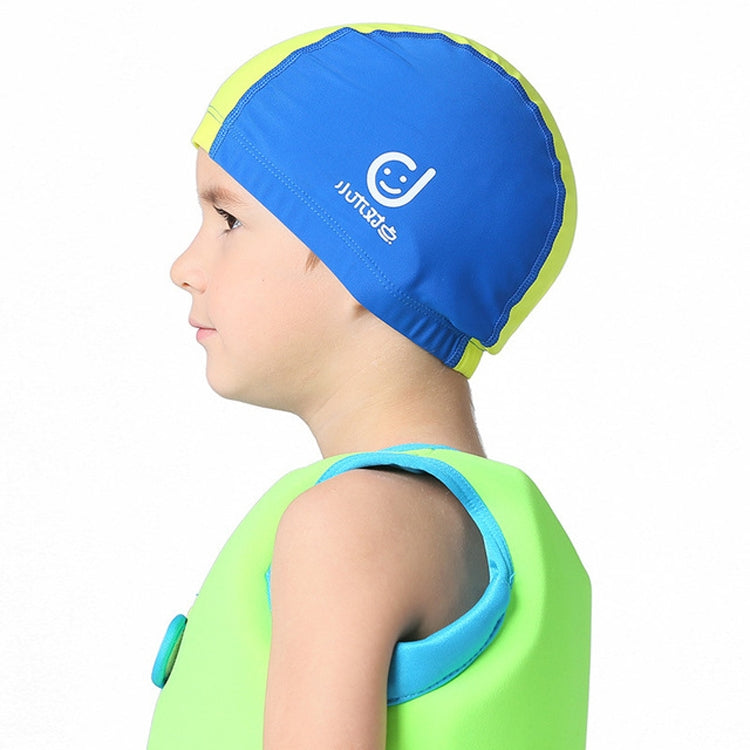 Kids' sun-protective swim cap in blue with yellow back panel and white logo