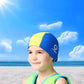 Kids' sun-protective swim cap on child in yellow with blue side panels and logo