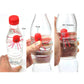 Red jellyfish toy inside a clear bottle, shown in three handling steps.